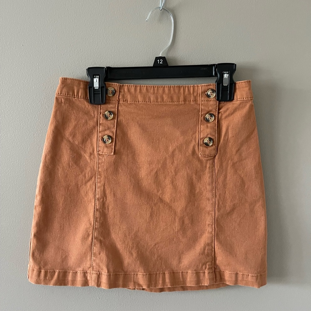 Copper Key Orange and tan skirt with buttons on each side.